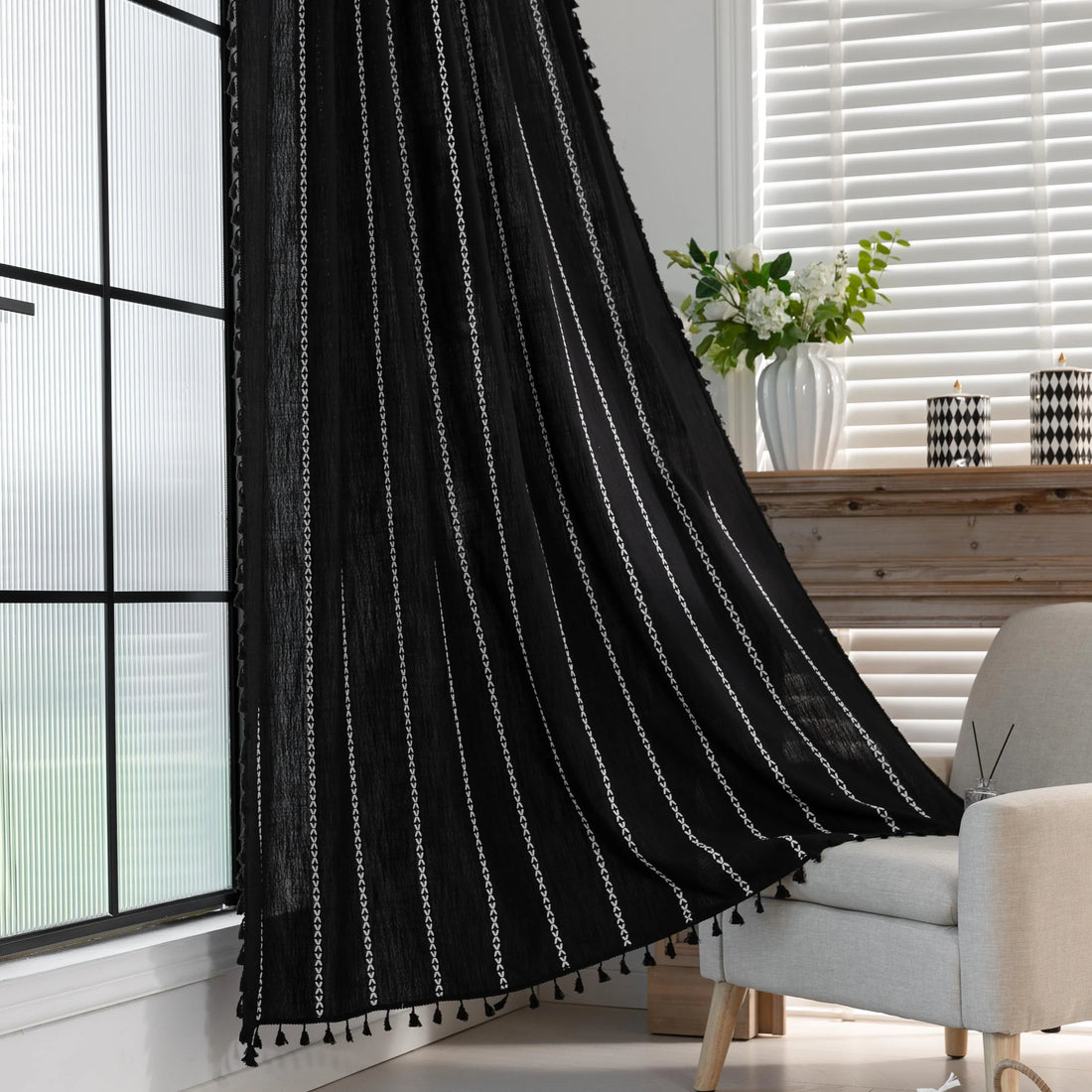 Elegant Black Tassel Curtains – Add a touch of sophistication to your home with these stylish black curtains featuring delicate vertical white embroidery and playful tassel trim. Crafted from lightweight, breathable fabric, they provide a perfect balance of privacy and natural light, making them ideal for living rooms, bedrooms, or reading nooks. The timeless black-and-white design complements modern, bohemian, and contemporary interiors, while the tassel detailing adds a chic, artisanal flair. Durable and 