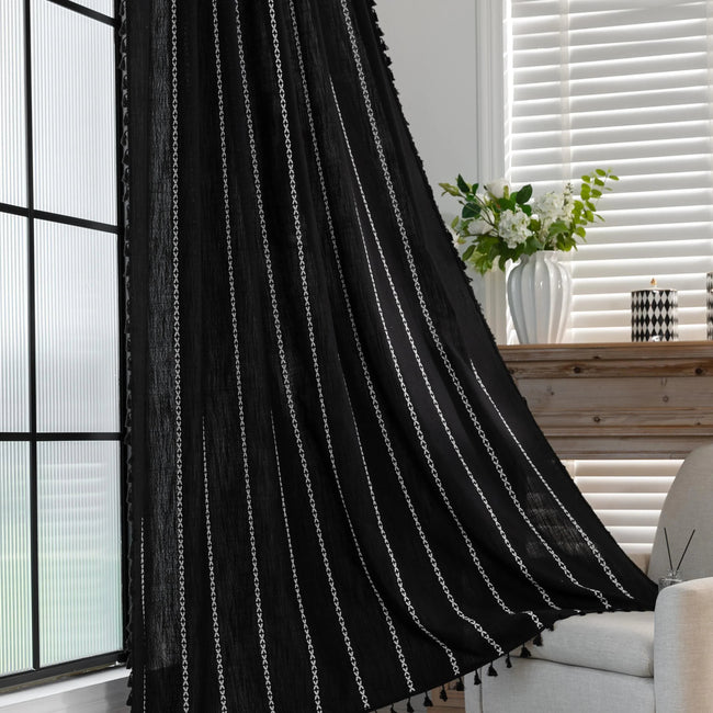 Elegant Black Tassel Curtains ¨C Add a touch of sophistication to your home with these stylish black curtains featuring delicate vertical white embroidery and playful tassel trim. Crafted from lightweight, breathable fabric, they provide a perfect balance of privacy and natural light, making them ideal for living rooms, bedrooms, or reading nooks. The timeless black-and-white design complements modern, bohemian, and contemporary interiors, while the tassel detailing adds a chic, artisanal flair. Durable and
