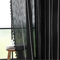 Elegant Black Tassel Curtains – Add a touch of sophistication to your home with these stylish black curtains featuring delicate vertical white embroidery and playful tassel trim. Crafted from lightweight, breathable fabric, they provide a perfect balance of privacy and natural light, making them ideal for living rooms, bedrooms, or reading nooks. The timeless black-and-white design complements modern, bohemian, and contemporary interiors, while the tassel detailing adds a chic, artisanal flair. Durable and 