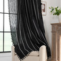 Elegant Black Tassel Curtains – Add a touch of sophistication to your home with these stylish black curtains featuring delicate vertical white embroidery and playful tassel trim. Crafted from lightweight, breathable fabric, they provide a perfect balance of privacy and natural light, making them ideal for living rooms, bedrooms, or reading nooks. The timeless black-and-white design complements modern, bohemian, and contemporary interiors, while the tassel detailing adds a chic, artisanal flair. Durable and 