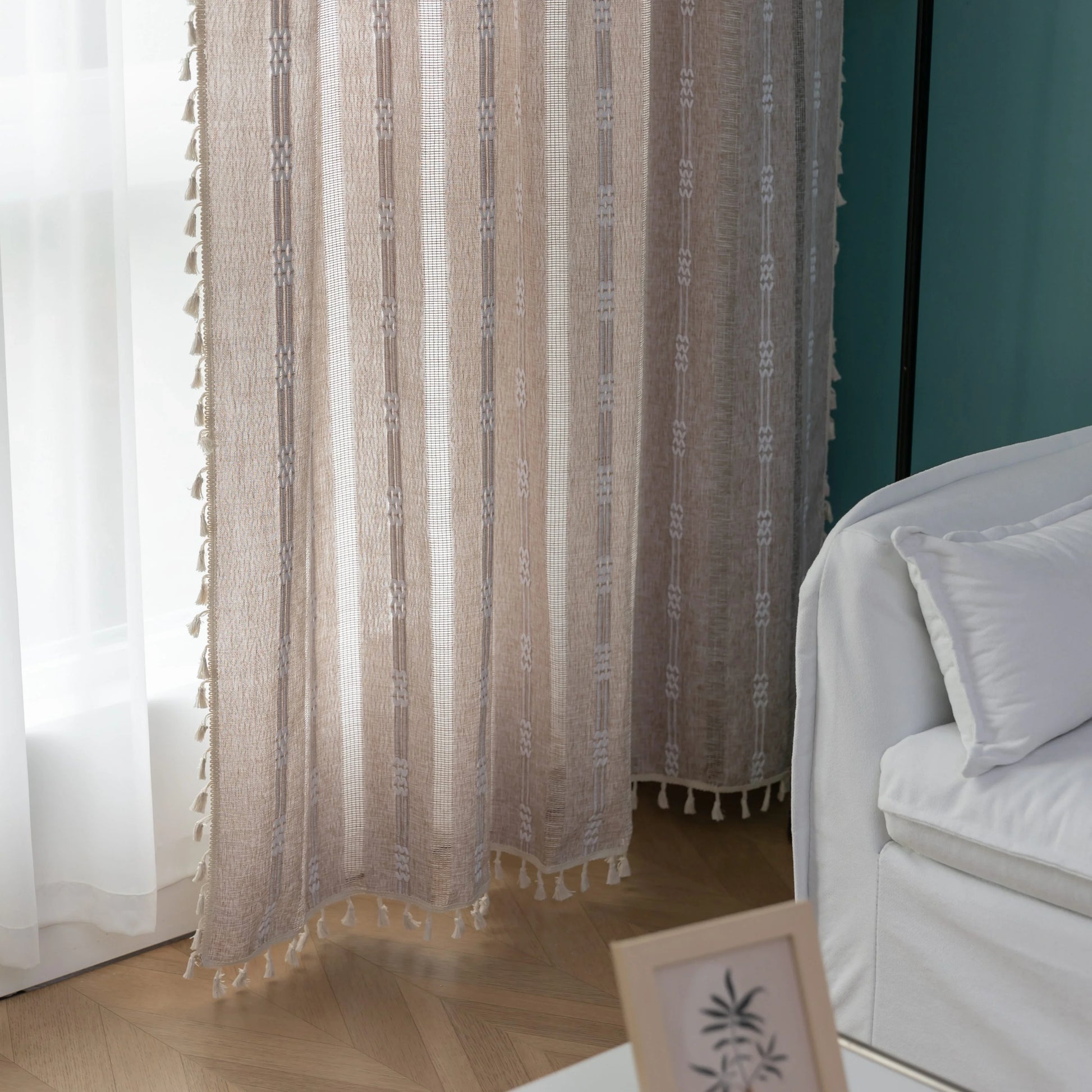 Light beige sheer curtain with subtle white embroidery and tassel edging — a breezy, elegant window treatment perfect for adding softness, texture, and natural light to any room décor.