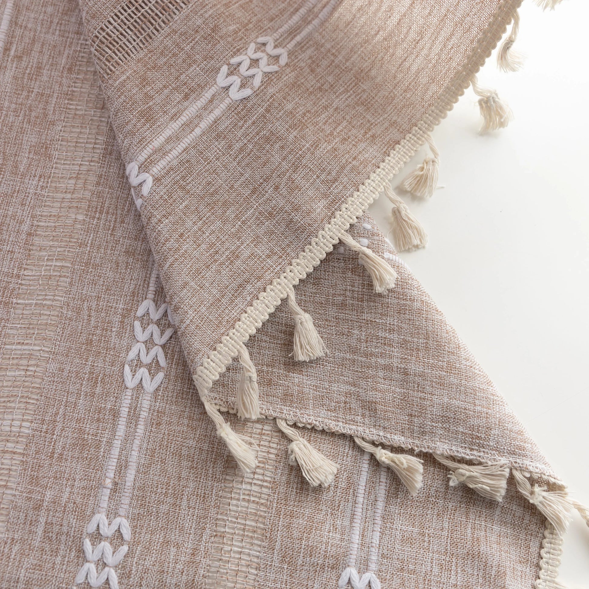 Light beige sheer curtain with subtle white embroidery and tassel edging — a breezy, elegant window treatment perfect for adding softness, texture, and natural light to any room décor.