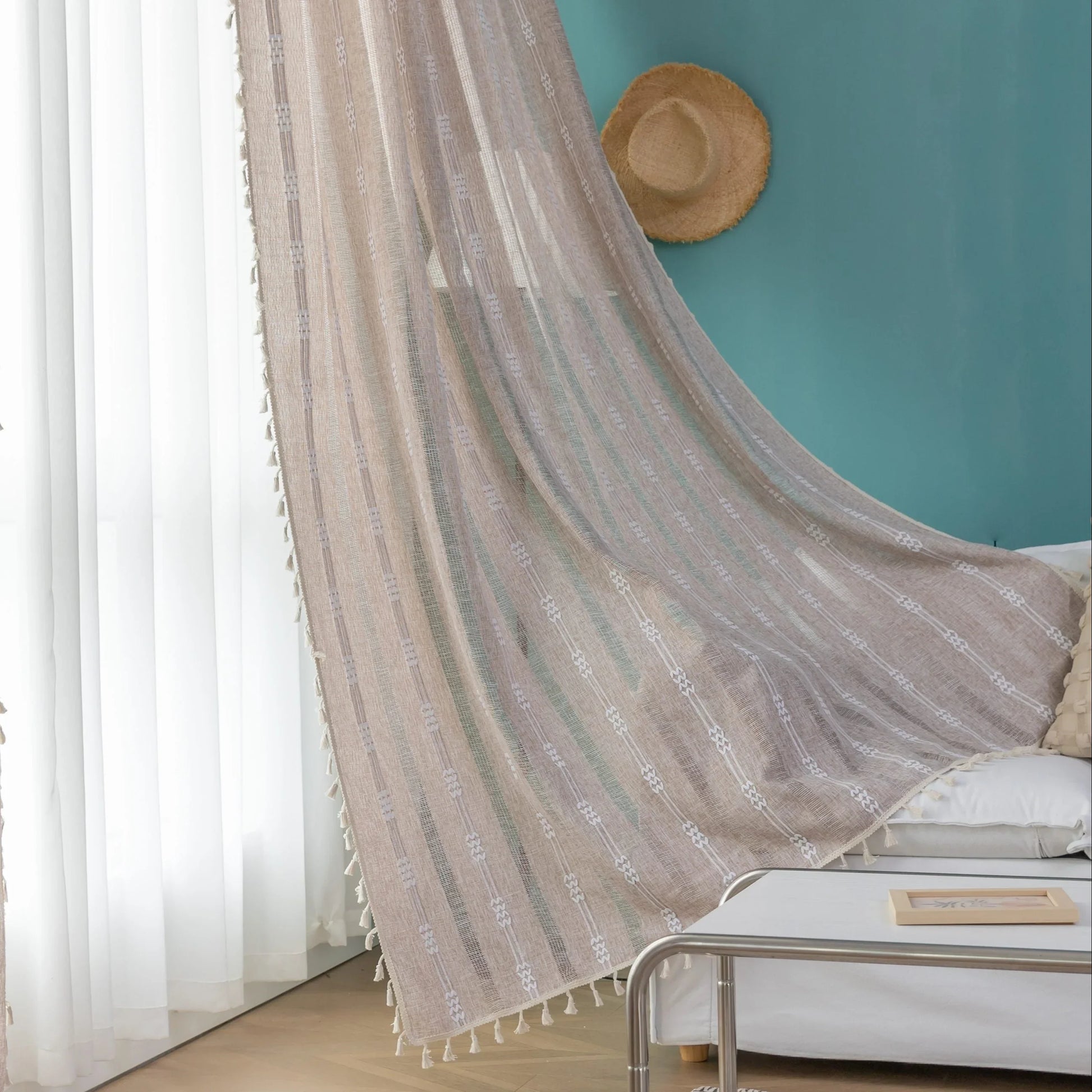Light beige sheer curtain with subtle white embroidery and tassel edging — a breezy, elegant window treatment perfect for adding softness, texture, and natural light to any room décor.