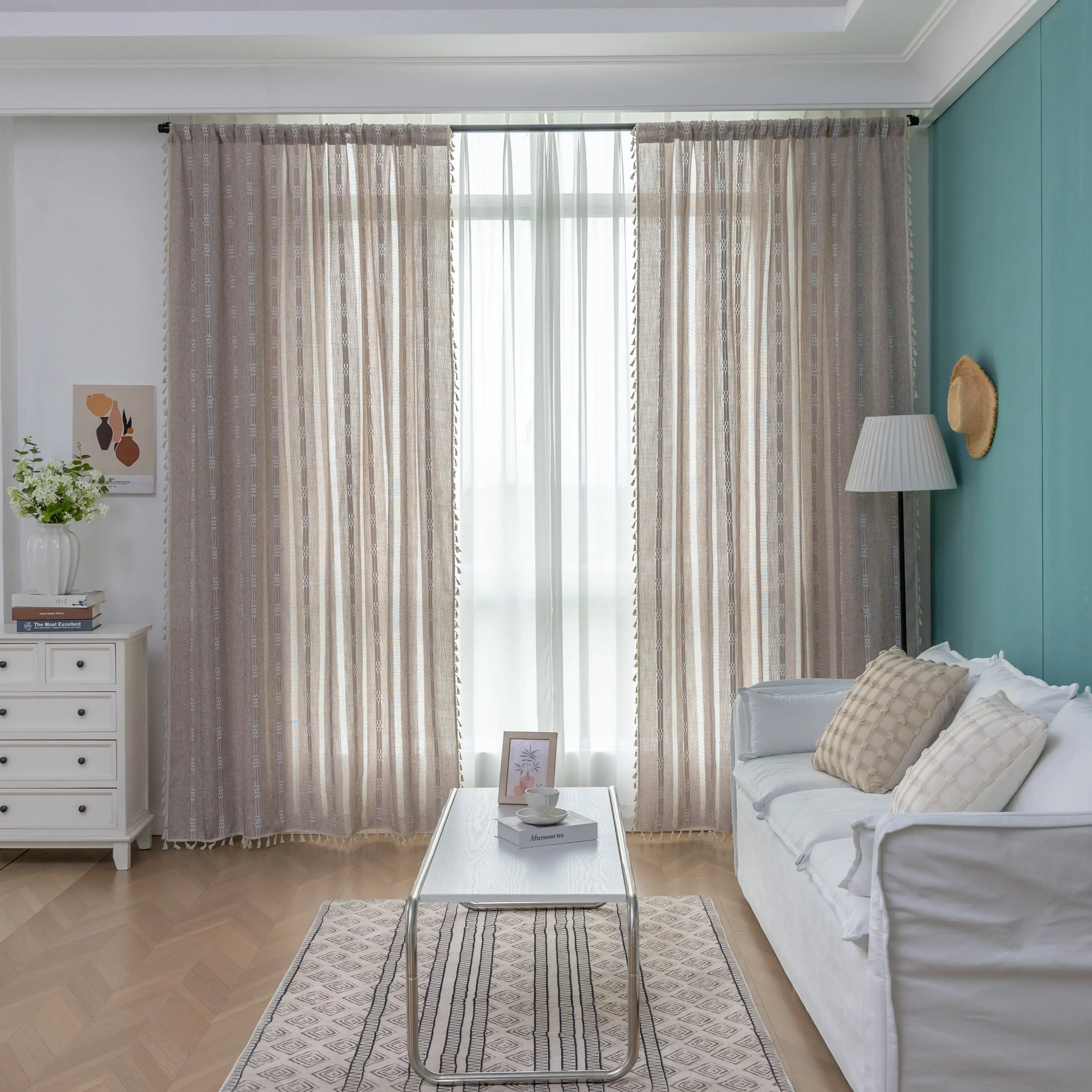 Light beige sheer curtain with subtle white embroidery and tassel edging — a breezy, elegant window treatment perfect for adding softness, texture, and natural light to any room décor.