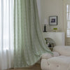 Soft green curtain with delicate vertical white embroidery and tassel trim ¡ª an airy and stylish window treatment ideal for creating a light, refreshing, and cozy atmosphere in any room.