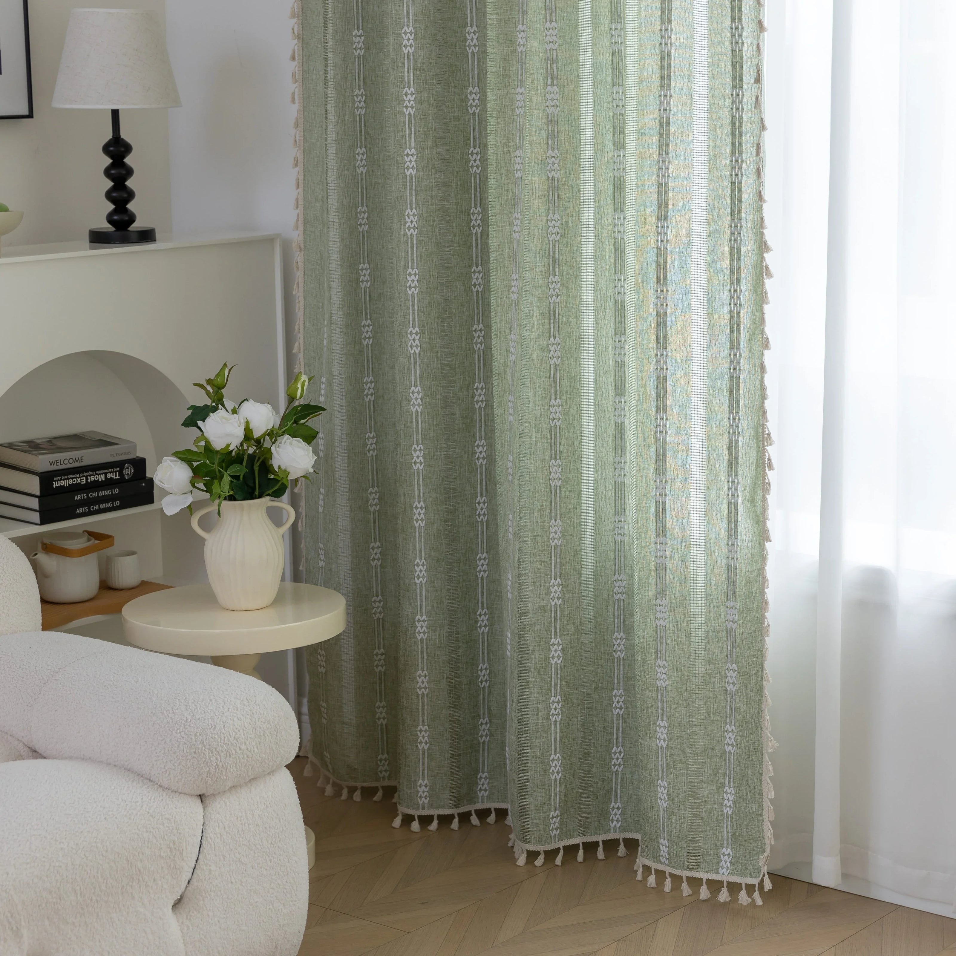 Soft green curtain with delicate vertical white embroidery and tassel trim ¡ª an airy and stylish window treatment ideal for creating a light, refreshing, and cozy atmosphere in any room.