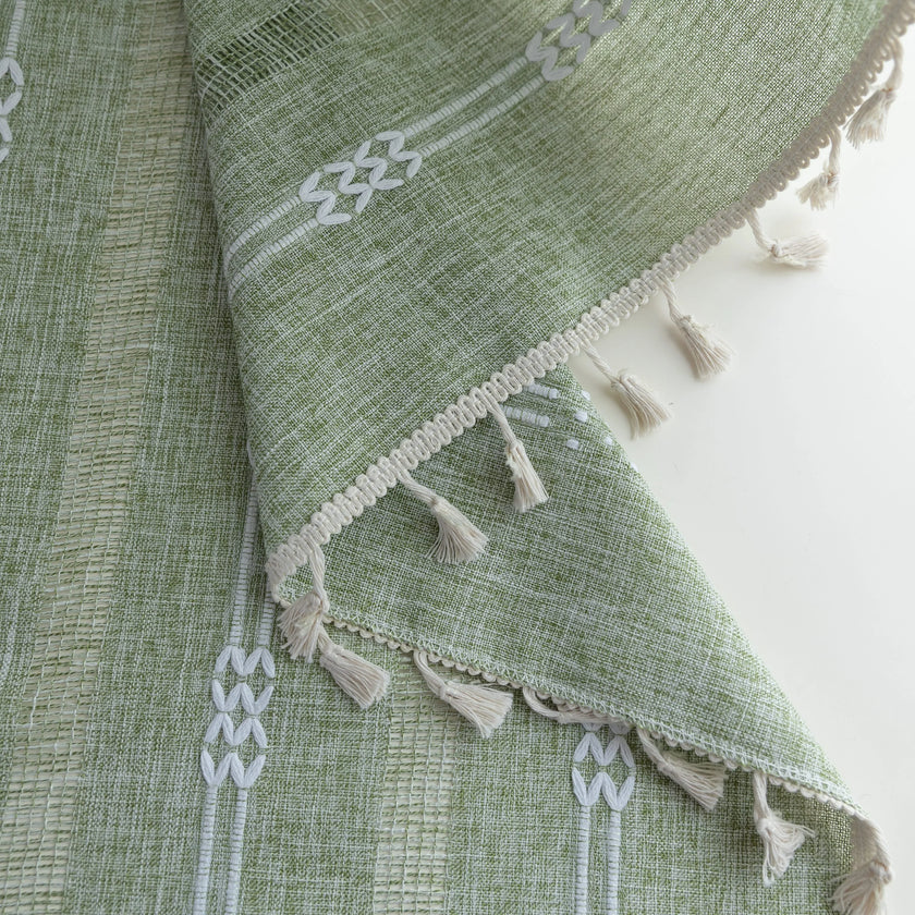 Soft green curtain with delicate vertical white embroidery and tassel trim ¡ª an airy and stylish window treatment ideal for creating a light, refreshing, and cozy atmosphere in any room.