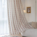 Elegant white curtain with vertical red embroidered stripes and subtle tassel edging — perfect for adding a touch of sophistication and warmth to your living room or bedroom décor.