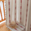 Red embroidery curtain with rod pocket top and vertical stitched detailing