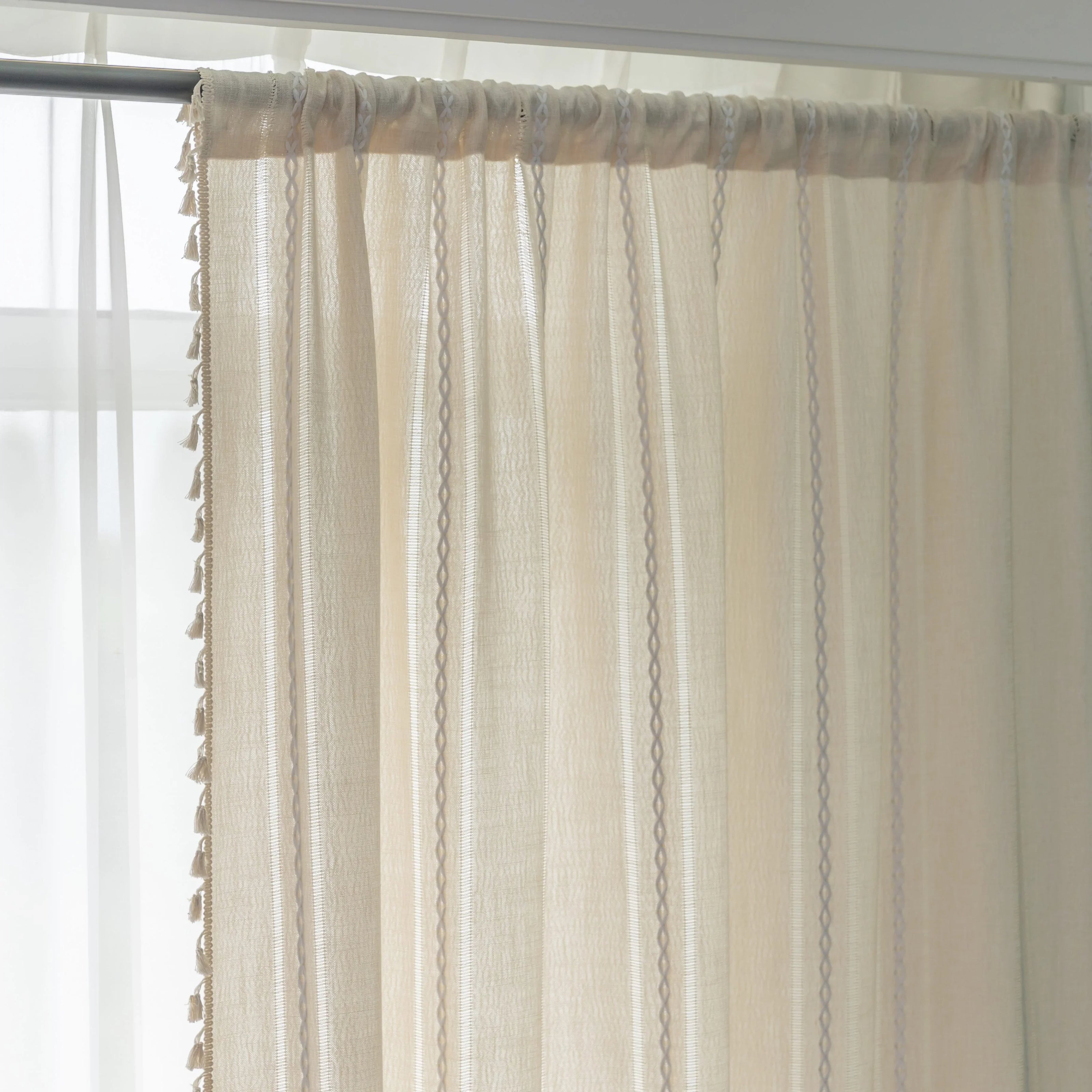 Ivory embroidery curtain styled by a window