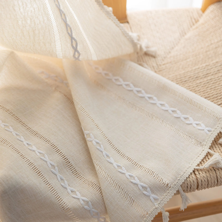 Ivory embroidery curtain with rod pocket top and soft light-filtering fabric