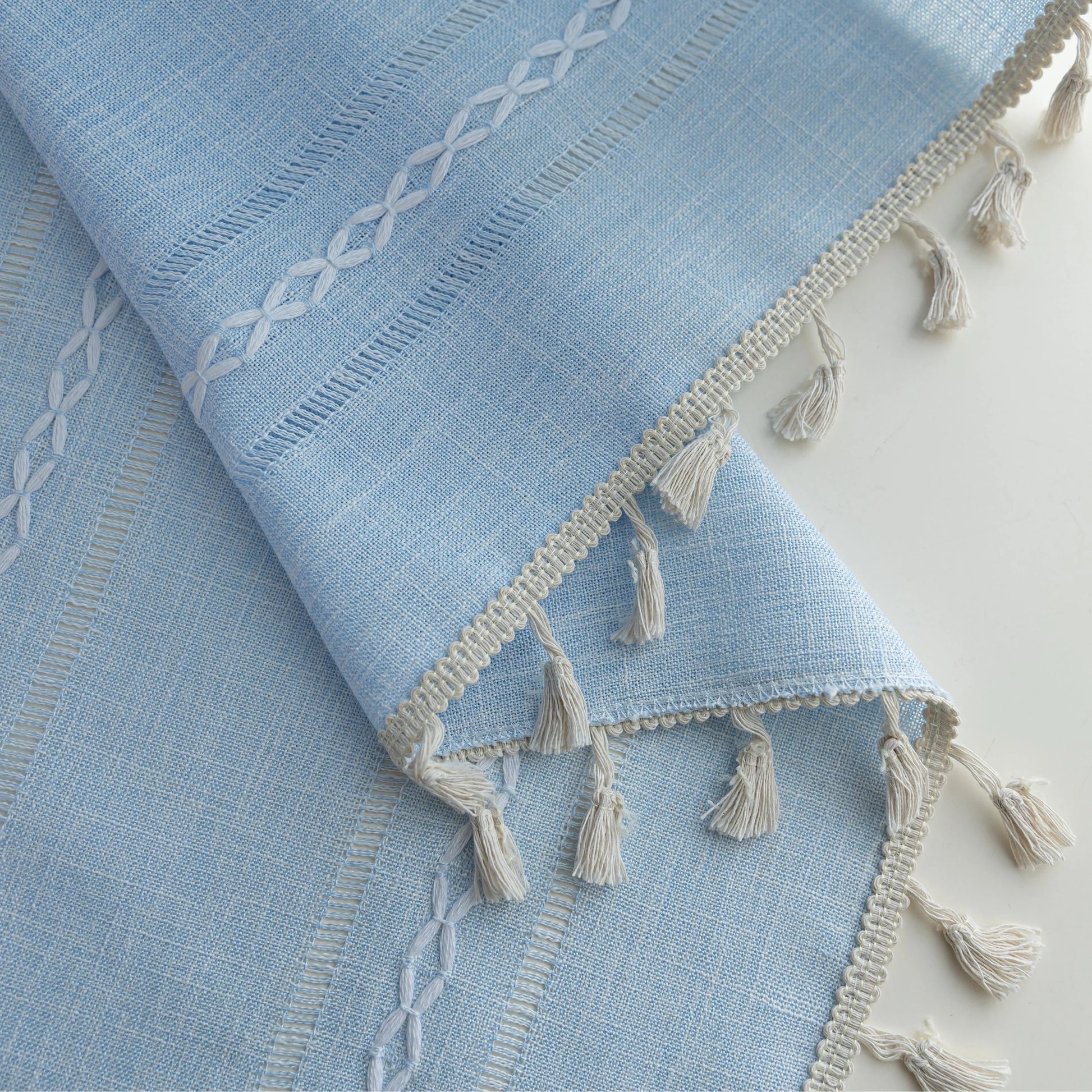 Light Blue Sheer Tassel Curtains – Bring a refreshing, airy charm to your home with these elegant light blue curtains, designed with delicate vertical weave patterns for subtle texture and style. The lightweight, semi-sheer fabric allows natural light to filter through while providing a soft layer of privacy. Finished with playful tassel edges, these curtains add a touch of coastal, bohemian, or contemporary elegance to any living room, bedroom, or dining area. Perfect for creating a serene and inviting atm