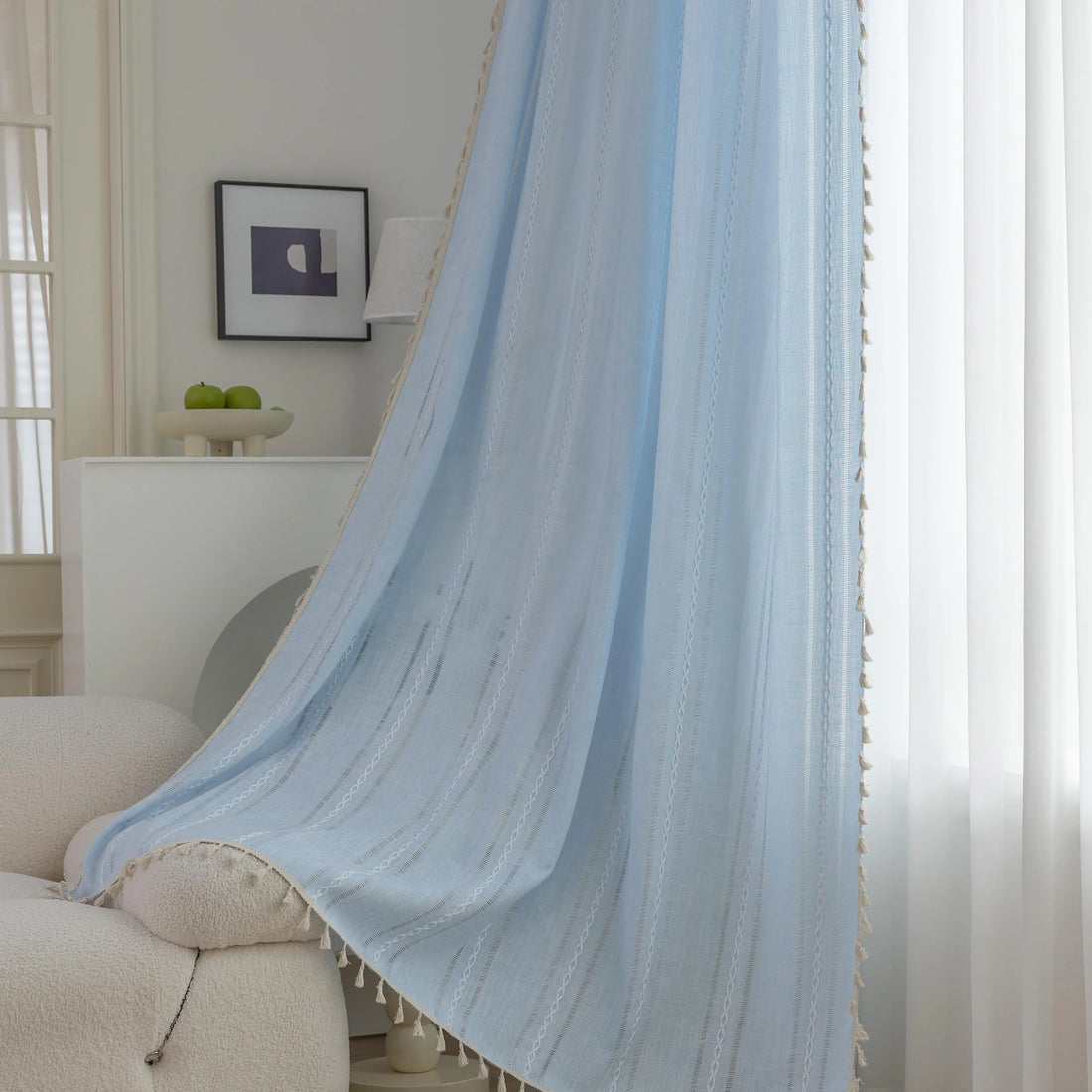 Light Blue Sheer Tassel Curtains – Bring a refreshing, airy charm to your home with these elegant light blue curtains, designed with delicate vertical weave patterns for subtle texture and style. The lightweight, semi-sheer fabric allows natural light to filter through while providing a soft layer of privacy. Finished with playful tassel edges, these curtains add a touch of coastal, bohemian, or contemporary elegance to any living room, bedroom, or dining area. Perfect for creating a serene and inviting atm