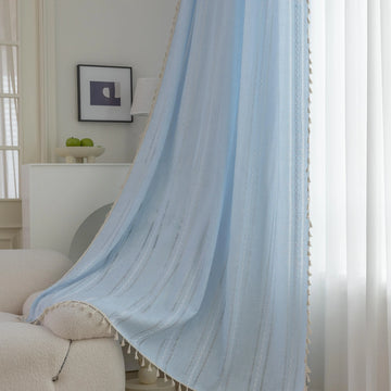 Light Blue Sheer Tassel Curtains – Bring a refreshing, airy charm to your home with these elegant light blue curtains, designed with delicate vertical weave patterns for subtle texture and style. The lightweight, semi-sheer fabric allows natural light to filter through while providing a soft layer of privacy. Finished with playful tassel edges, these curtains add a touch of coastal, bohemian, or contemporary elegance to any living room, bedroom, or dining area. Perfect for creating a serene and inviting atm
