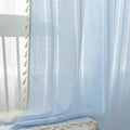 Light Blue Sheer Tassel Curtains – Bring a refreshing, airy charm to your home with these elegant light blue curtains, designed with delicate vertical weave patterns for subtle texture and style. The lightweight, semi-sheer fabric allows natural light to filter through while providing a soft layer of privacy. Finished with playful tassel edges, these curtains add a touch of coastal, bohemian, or contemporary elegance to any living room, bedroom, or dining area. Perfect for creating a serene and inviting atm