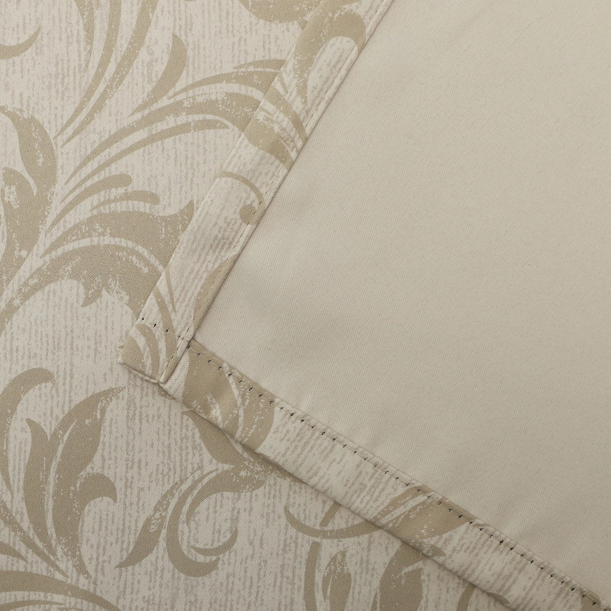 Beige blackout curtain with elegant floral patterns, offering excellent light blocking, enhanced privacy, and a warm, sophisticated look for living rooms, bedrooms, or home offices.