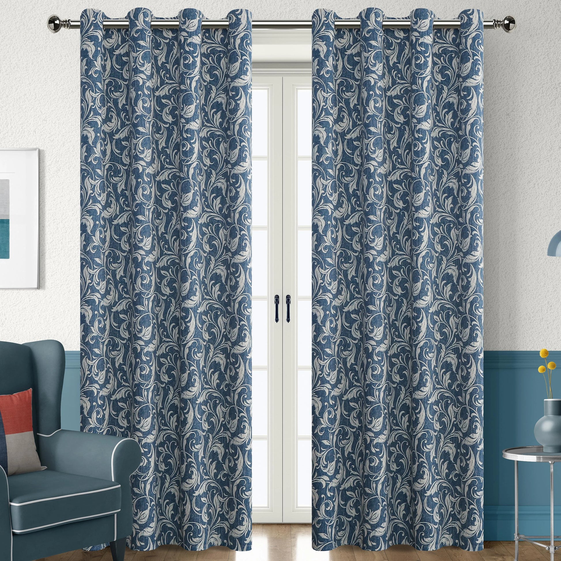 Elegant blue blackout curtain with intricate white floral patterns, designed to block sunlight, enhance privacy, and add a sophisticated touch to any living room or bedroom décor.