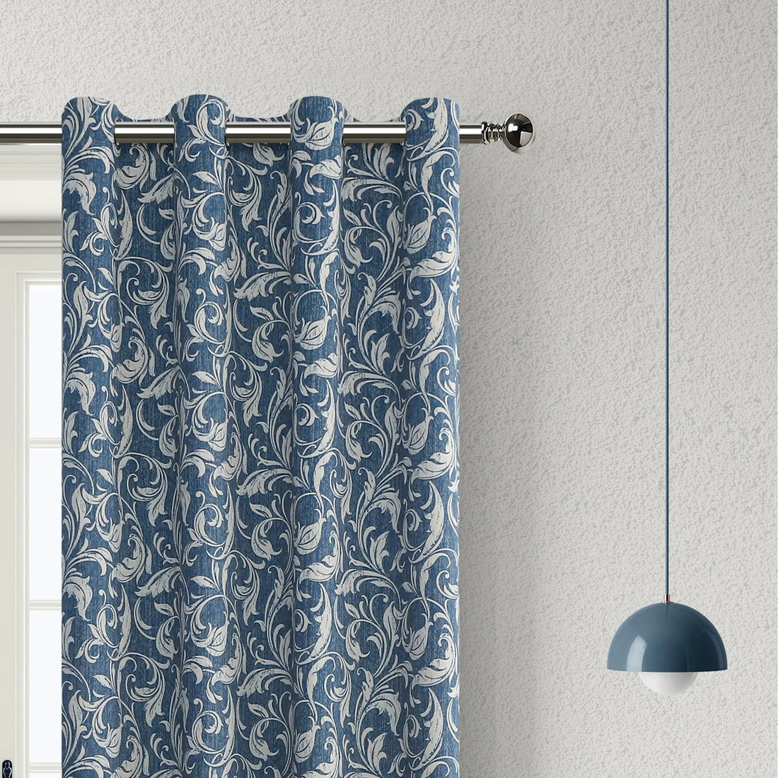 Elegant blue blackout curtain with intricate white floral patterns, designed to block sunlight, enhance privacy, and add a sophisticated touch to any living room or bedroom décor.