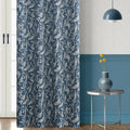 Elegant blue blackout curtain with intricate white floral patterns, designed to block sunlight, enhance privacy, and add a sophisticated touch to any living room or bedroom décor.