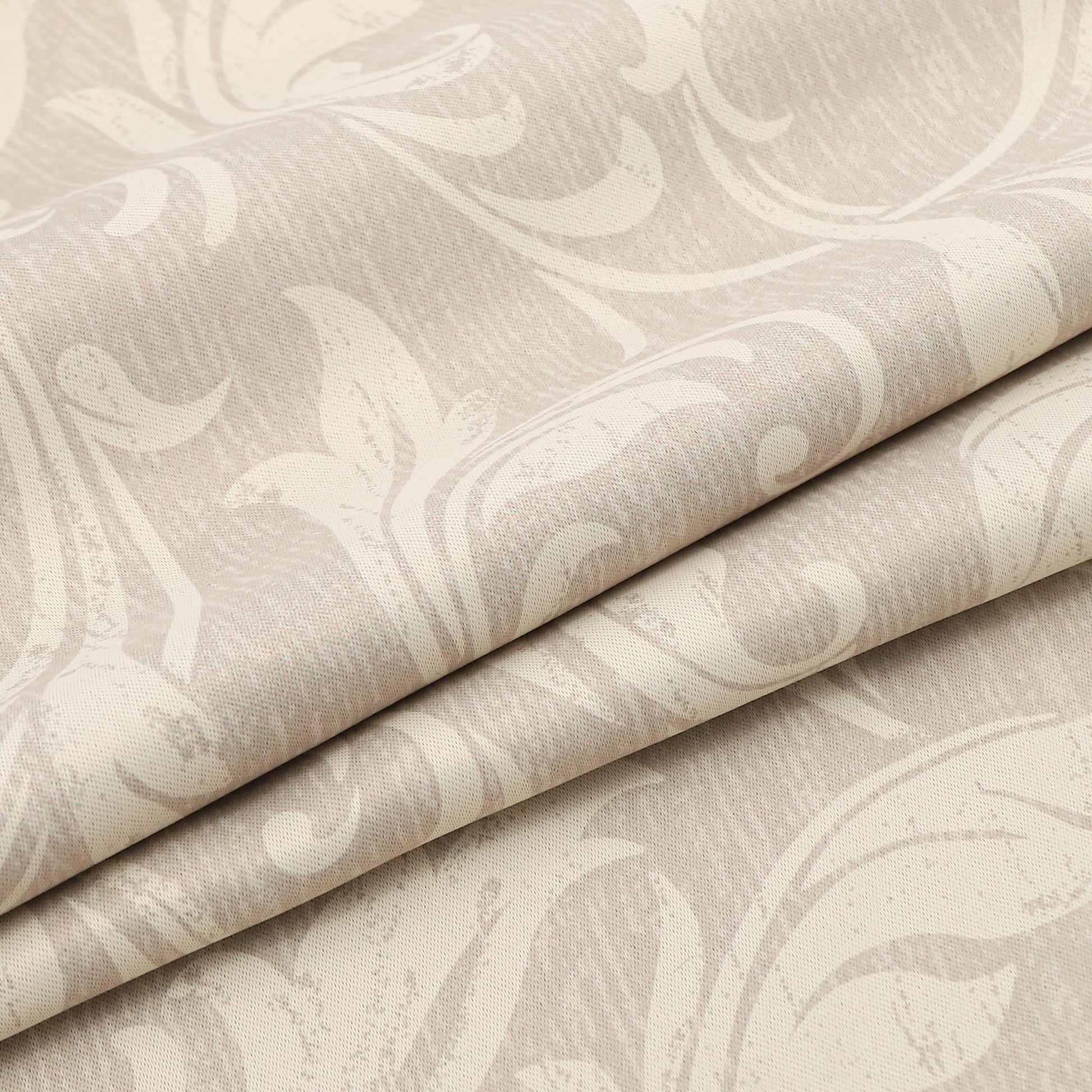 Ivory blackout curtain with delicate floral patterns, designed to block sunlight, ensure privacy, and add a touch of timeless elegance to bedrooms, living rooms, or study spaces.