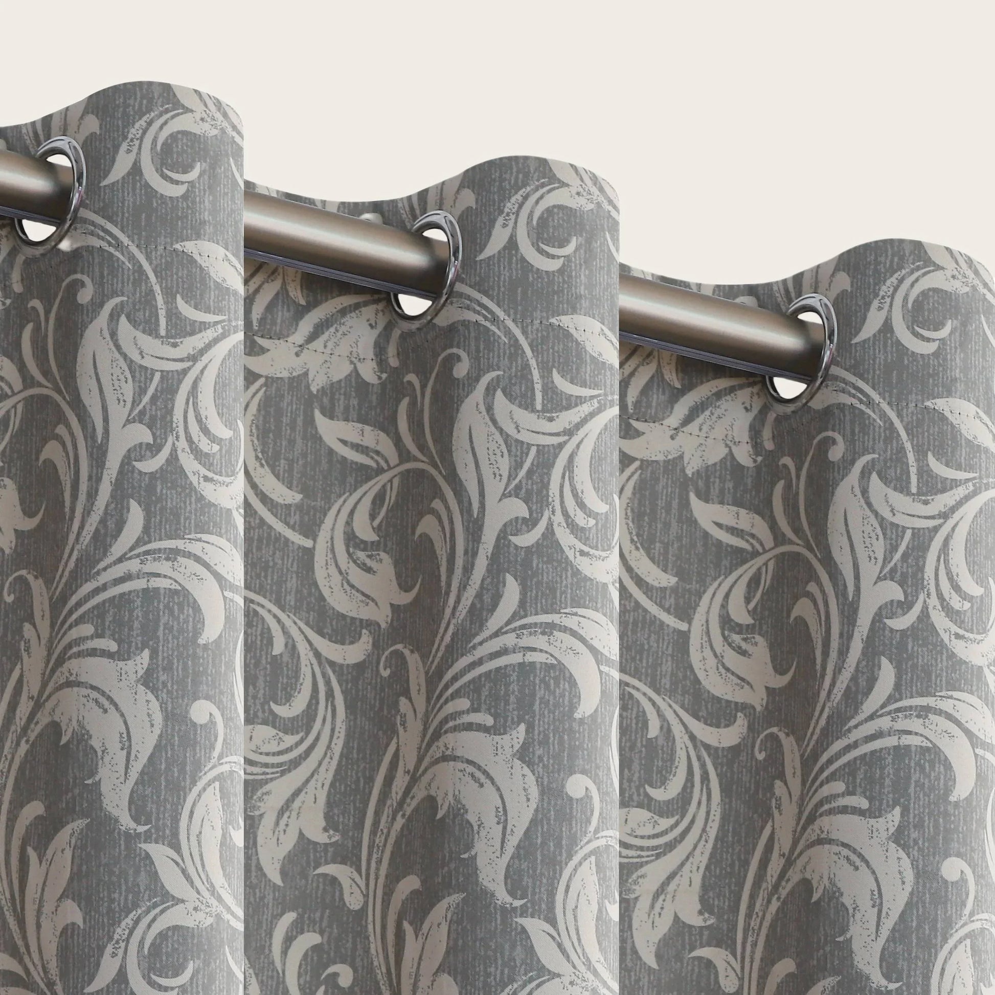 Elegant grey blackout curtain featuring intricate white floral patterns, perfect for blocking sunlight, enhancing privacy, and adding a sophisticated touch to any bedroom, living room, or office décor.