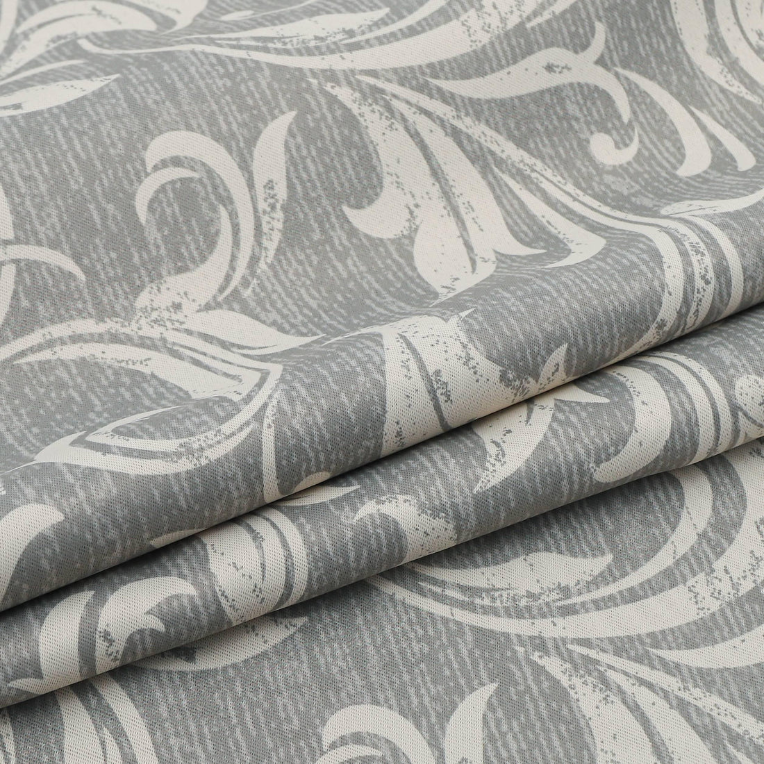 Elegant grey blackout curtain featuring intricate white floral patterns, perfect for blocking sunlight, enhancing privacy, and adding a sophisticated touch to any bedroom, living room, or office décor.