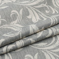 Elegant grey blackout curtain featuring intricate white floral patterns, perfect for blocking sunlight, enhancing privacy, and adding a sophisticated touch to any bedroom, living room, or office décor.