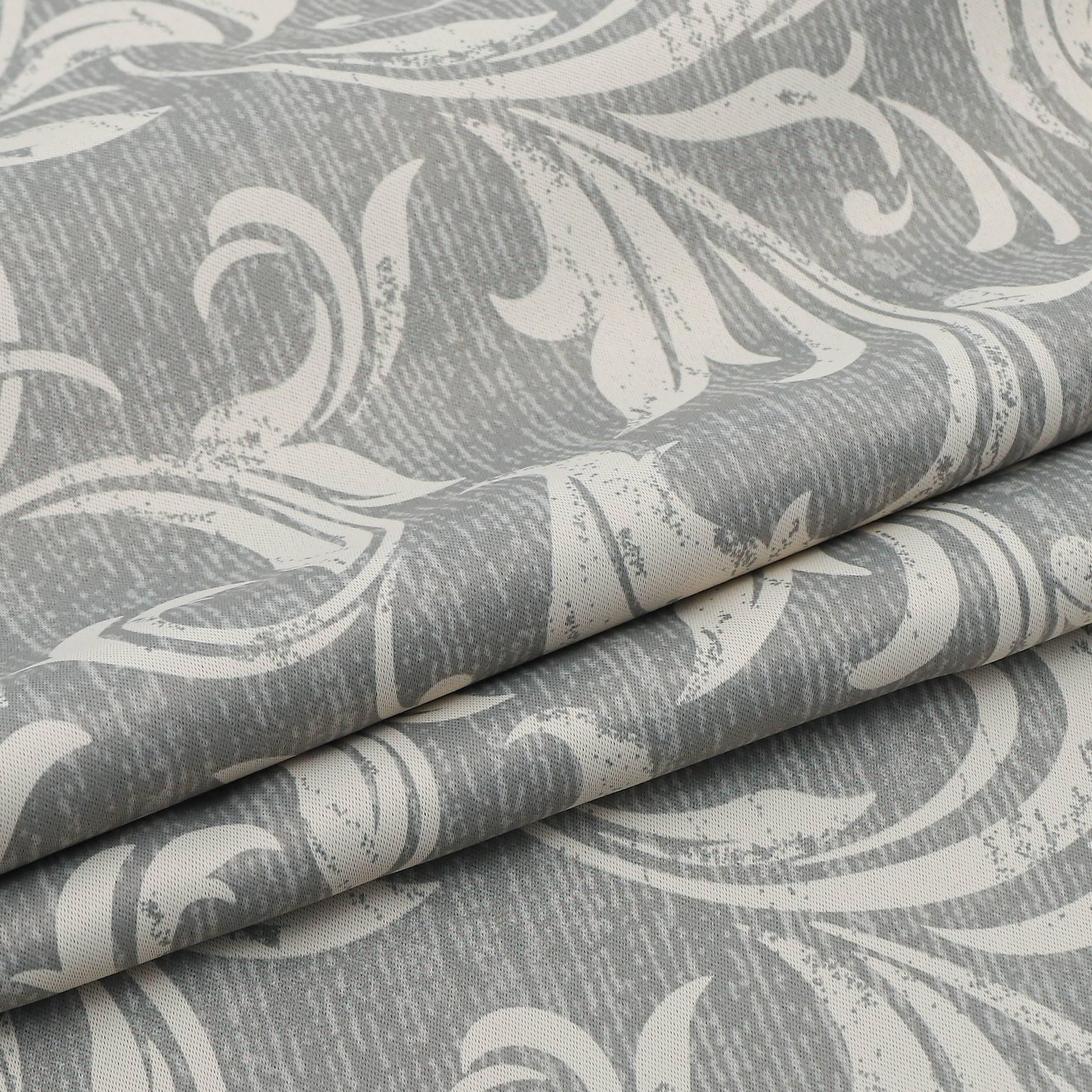 Elegant grey blackout curtain featuring intricate white floral patterns, perfect for blocking sunlight, enhancing privacy, and adding a sophisticated touch to any bedroom, living room, or office décor.