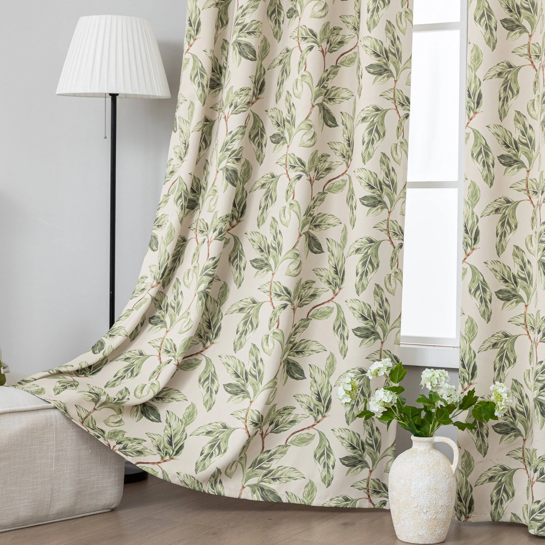Nature-inspired blackout curtain with lush green leaf prints on a beige background, designed to block sunlight, enhance privacy, and bring a fresh, botanical charm to your living room, bedroom, or dining space.