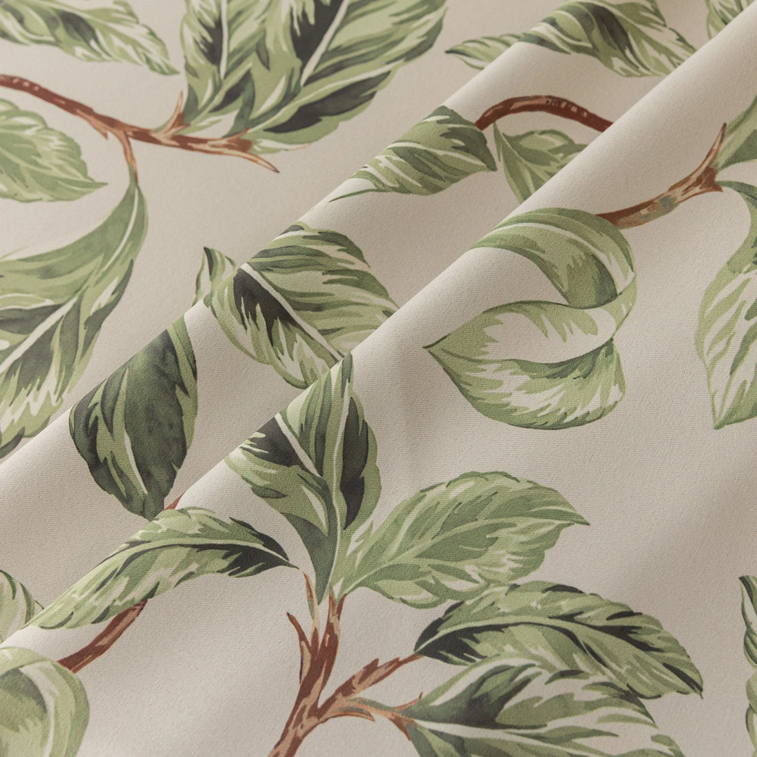Nature-inspired blackout curtain with lush green leaf prints on a beige background, designed to block sunlight, enhance privacy, and bring a fresh, botanical charm to your living room, bedroom, or dining space.