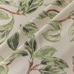 Nature-inspired blackout curtain with lush green leaf prints on a beige background, designed to block sunlight, enhance privacy, and bring a fresh, botanical charm to your living room, bedroom, or dining space.