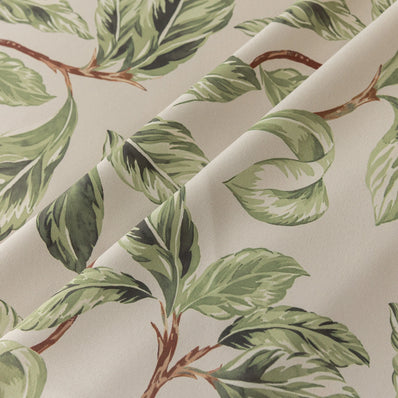 Nature-inspired blackout curtain with lush green leaf prints on a beige background, designed to block sunlight, enhance privacy, and bring a fresh, botanical charm to your living room, bedroom, or dining space.