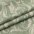 Elegant green blackout curtain with intricate floral vine patterns, offering superior light blocking, privacy, and a fresh, stylish touch for living rooms, bedrooms, or dining areas.