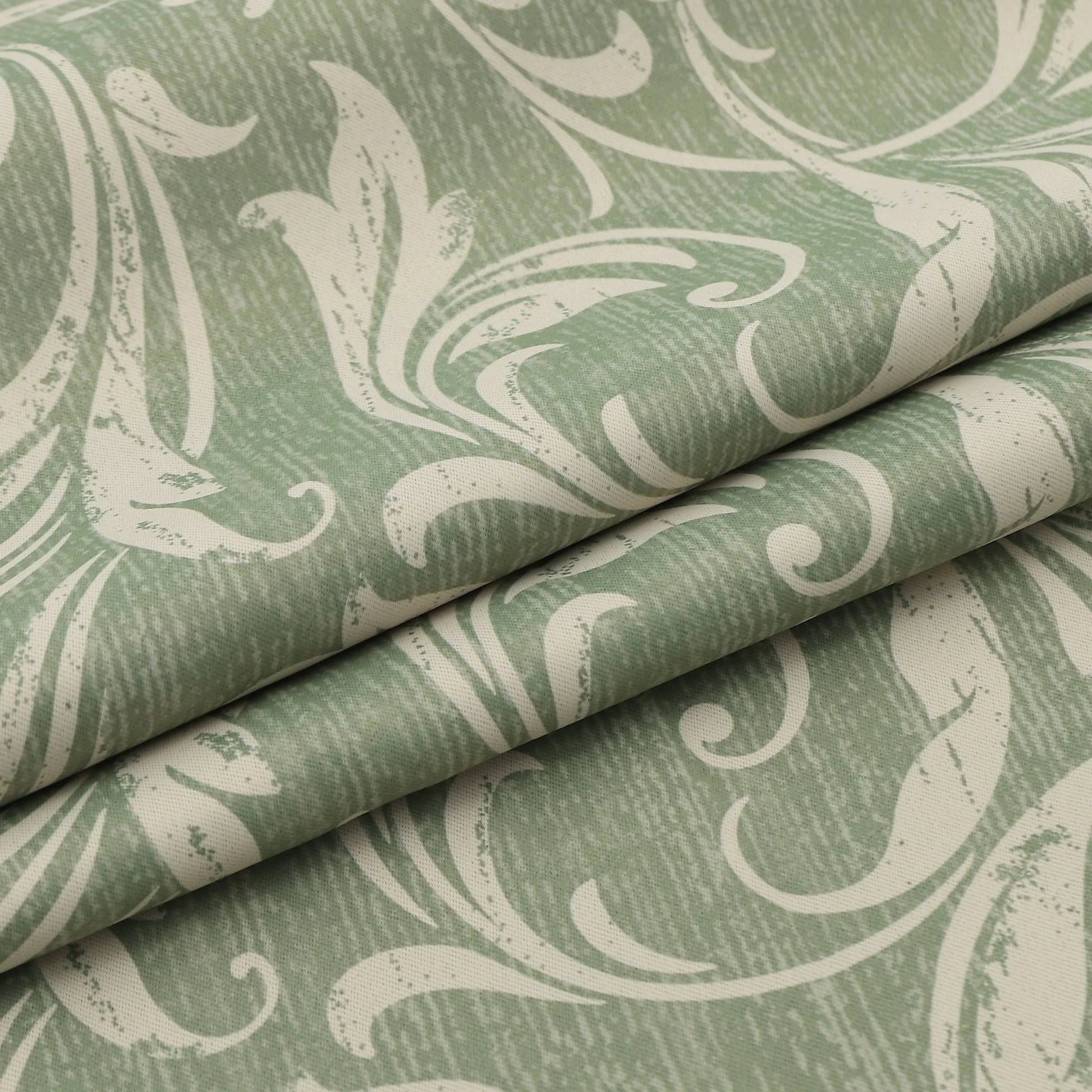 Elegant green blackout curtain with intricate floral vine patterns, offering superior light blocking, privacy, and a fresh, stylish touch for living rooms, bedrooms, or dining areas.