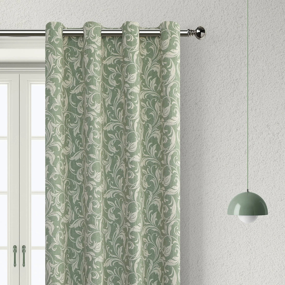 Elegant green blackout curtain with intricate floral vine patterns, offering superior light blocking, privacy, and a fresh, stylish touch for living rooms, bedrooms, or dining areas.