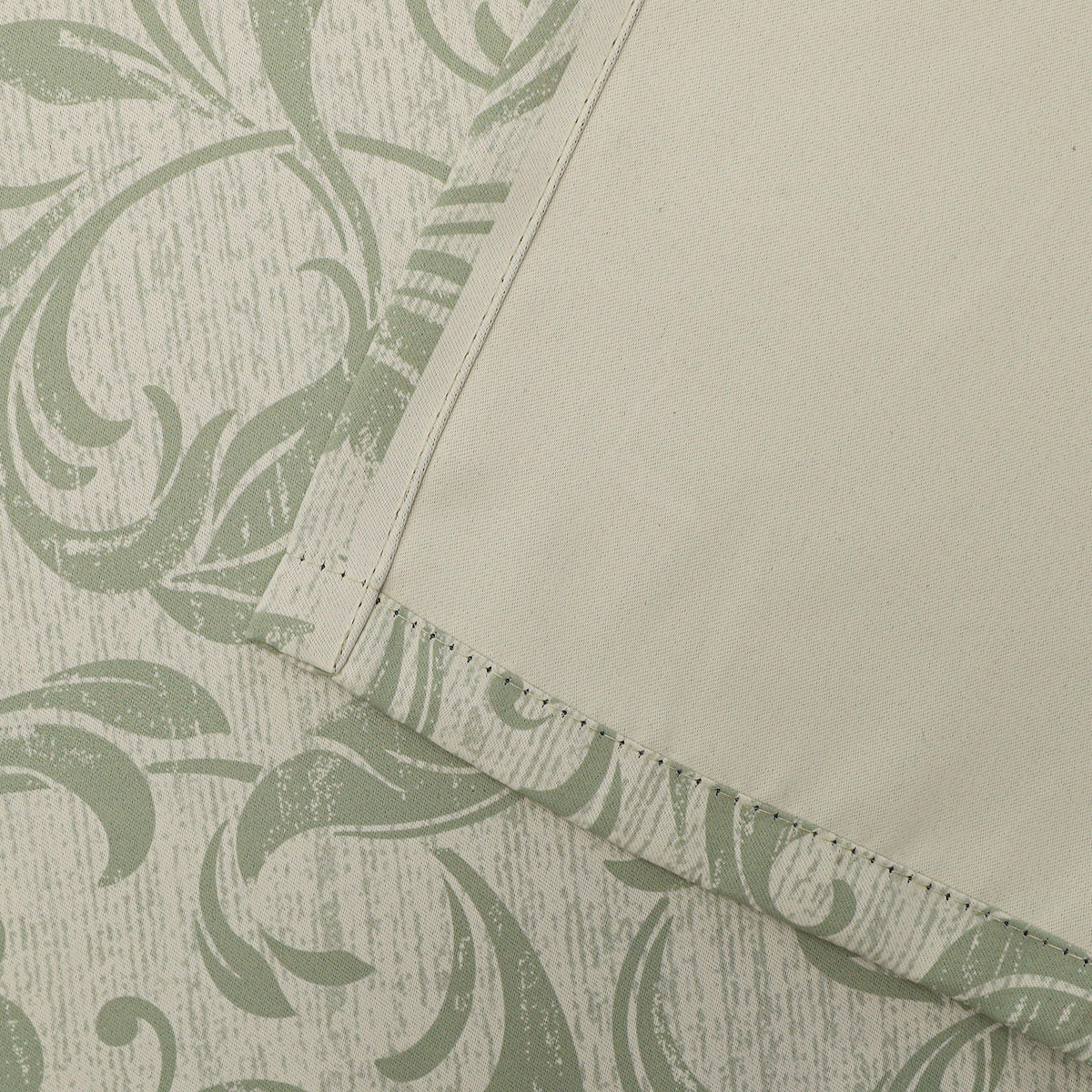 Stylish beige blackout curtain with soft green vine patterns, delivering excellent light blocking and privacy while adding a fresh, elegant touch to living rooms, bedrooms, or dining spaces.