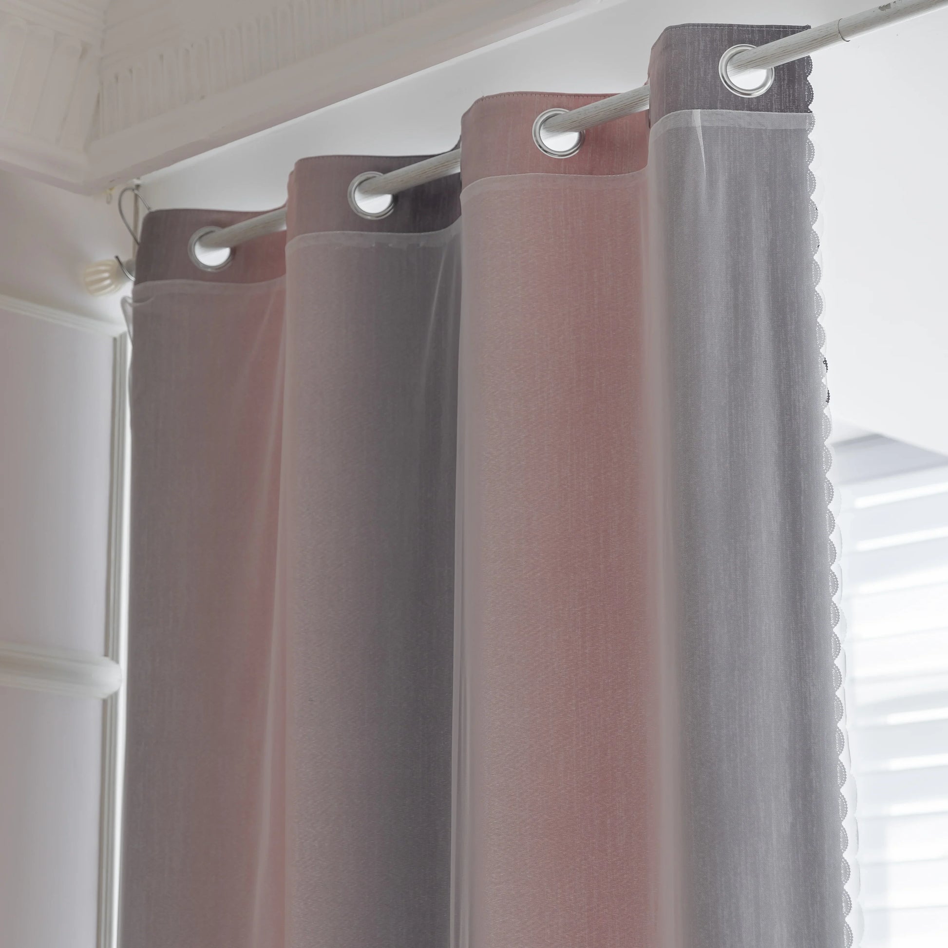 Modern gradient blackout curtain in soft pink and grey tones, offering superior light-blocking and privacy while adding a chic, contemporary touch to your bedroom or living room décor.