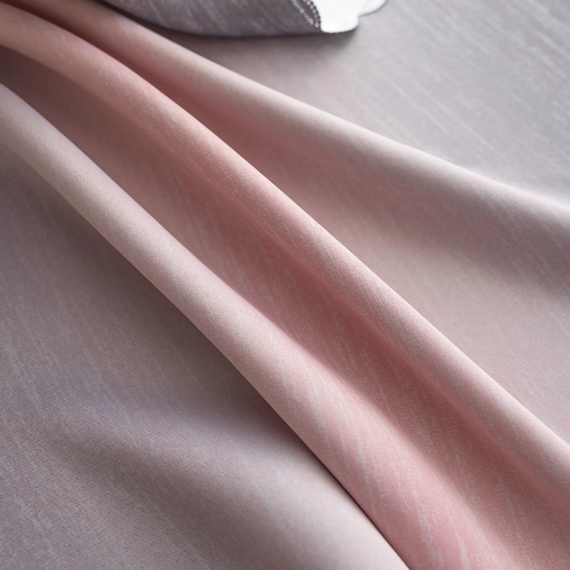 Modern gradient blackout curtain in soft pink and grey tones, offering superior light-blocking and privacy while adding a chic, contemporary touch to your bedroom or living room décor.