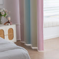 Colorful gradient blackout curtain with soft pink, yellow, and teal hues, designed to block light, enhance privacy, and bring a vibrant, modern charm to any bedroom or living space.