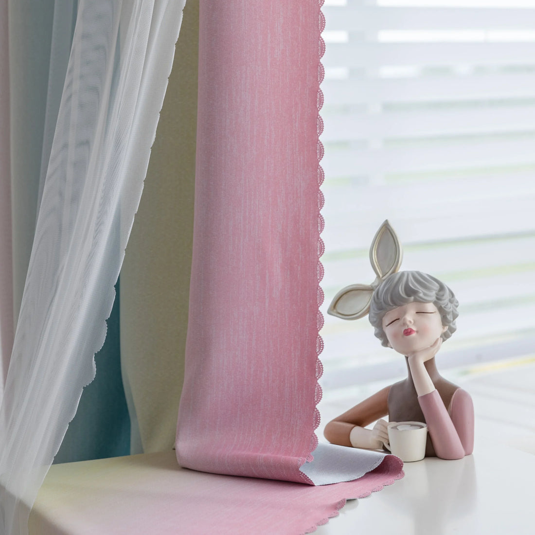 Colorful gradient blackout curtain with soft pink, yellow, and teal hues, designed to block light, enhance privacy, and bring a vibrant, modern charm to any bedroom or living space.