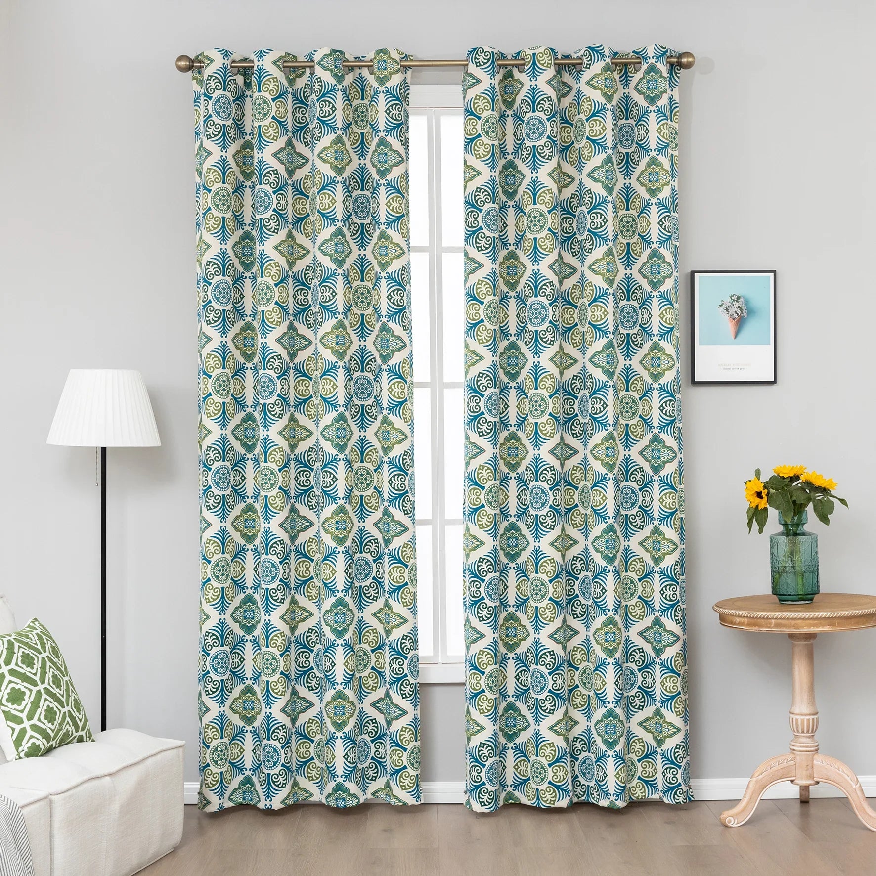 Modern geometric blackout curtain featuring bold teal and green tile-inspired patterns on a cream background, offering stylish decor while blocking sunlight and enhancing privacy.
