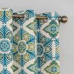 Modern geometric blackout curtain featuring bold teal and green tile-inspired patterns on a cream background, offering stylish decor while blocking sunlight and enhancing privacy.