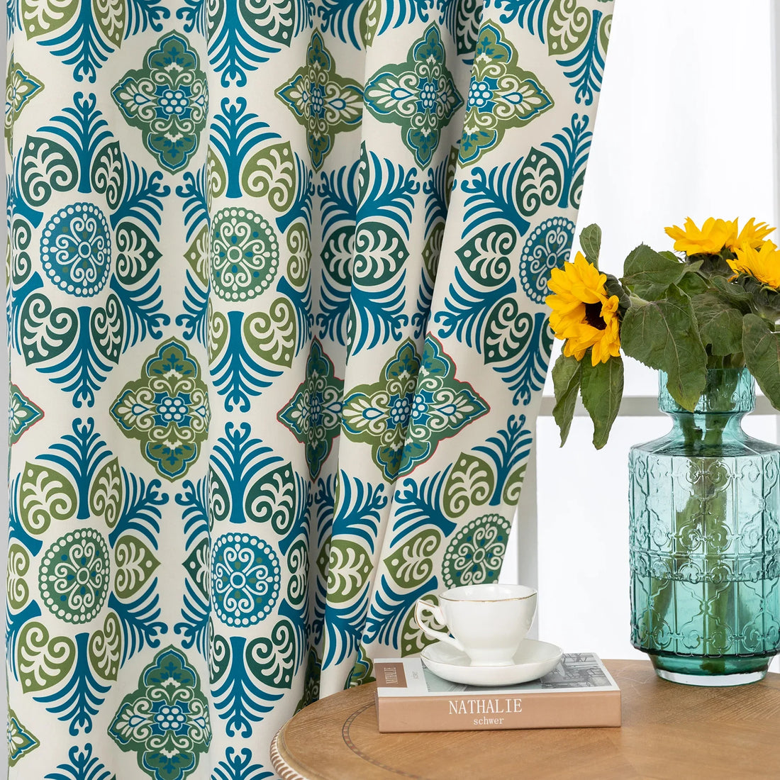 Modern geometric blackout curtain featuring bold teal and green tile-inspired patterns on a cream background, offering stylish decor while blocking sunlight and enhancing privacy.