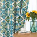 Modern geometric blackout curtain featuring bold teal and green tile-inspired patterns on a cream background, offering stylish decor while blocking sunlight and enhancing privacy.
