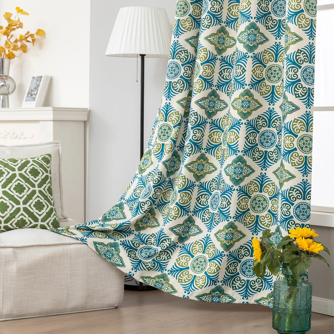 Modern geometric blackout curtain featuring bold teal and green tile-inspired patterns on a cream background, offering stylish decor while blocking sunlight and enhancing privacy.