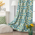 Modern geometric blackout curtain featuring bold teal and green tile-inspired patterns on a cream background, offering stylish decor while blocking sunlight and enhancing privacy.