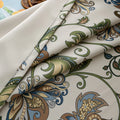 Elegant floral blackout curtain featuring intricate blue, green, and gold leaf patterns on a cream background, perfect for adding classic charm while effectively blocking light and ensuring privacy.