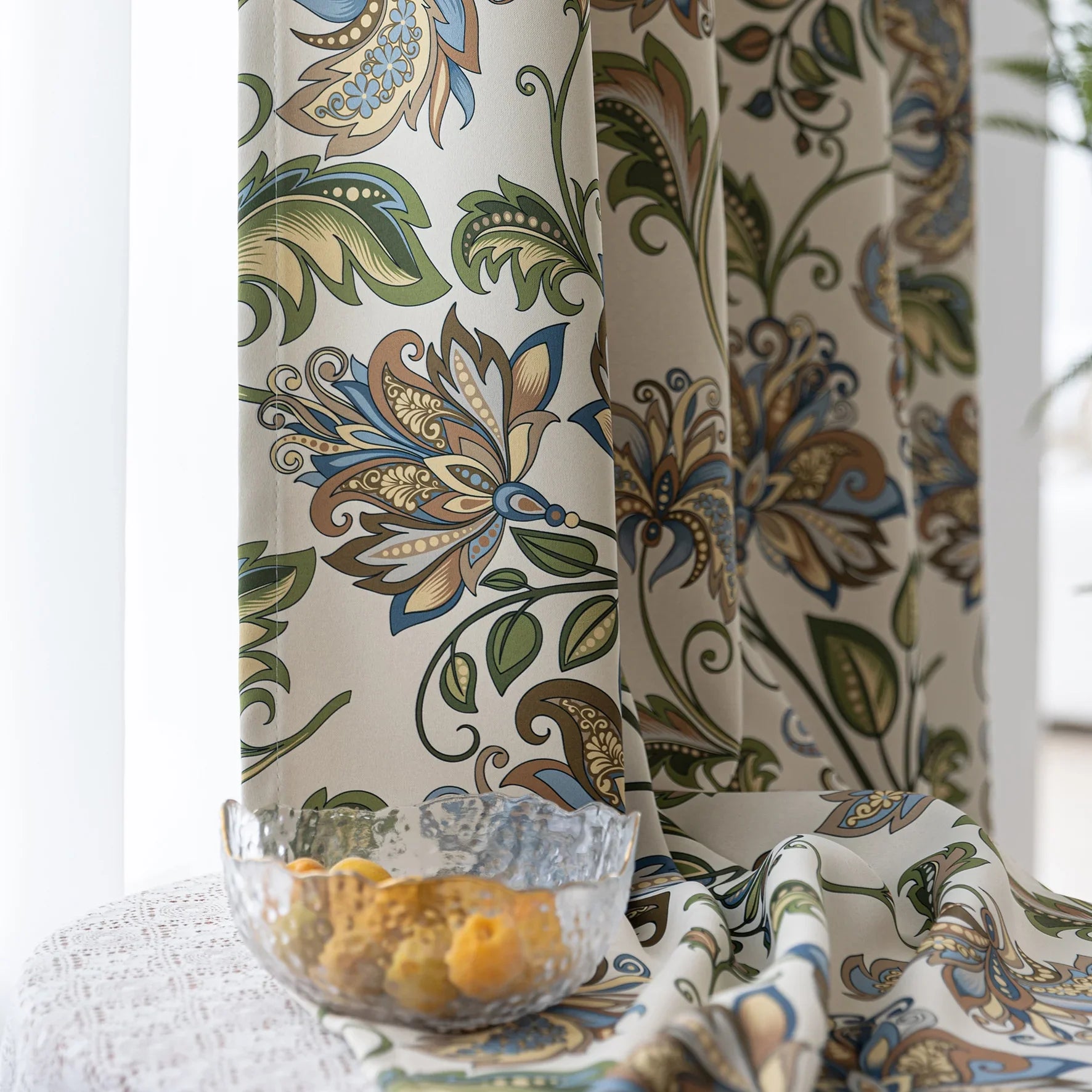 Elegant floral blackout curtain featuring intricate blue, green, and gold leaf patterns on a cream background, perfect for adding classic charm while effectively blocking light and ensuring privacy.