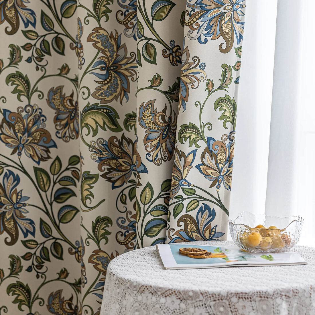 Elegant floral blackout curtain featuring intricate blue, green, and gold leaf patterns on a cream background, perfect for adding classic charm while effectively blocking light and ensuring privacy.