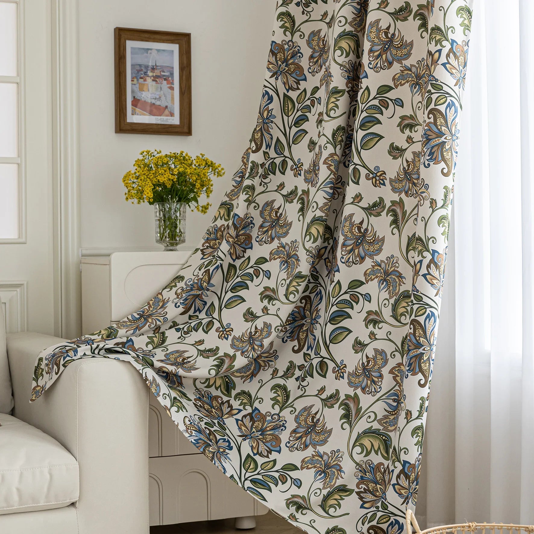 Elegant floral blackout curtain featuring intricate blue, green, and gold leaf patterns on a cream background, perfect for adding classic charm while effectively blocking light and ensuring privacy.